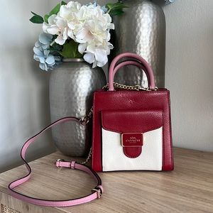 Never before used Coach Mini Pepper Crossbody bag.